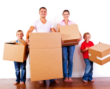Workers and moving boxes representing ethical removal services
