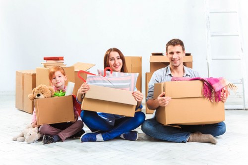 Removal van and moving team preparing for a house move