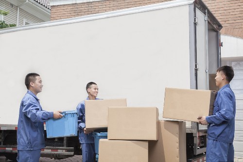 Bulky furniture being loaded for pick-up in Brixton