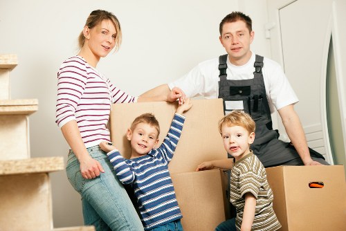 Local moving team organizing boxes and fragile items in Brixton