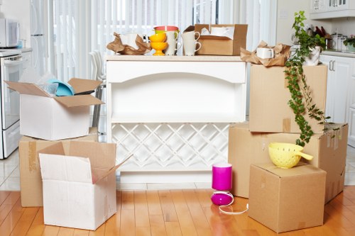 Staff preparing desks and equipment for an office move in Brixton