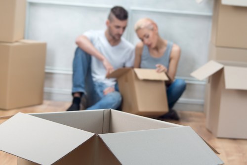 Professional movers packing boxes for a Brixton house removal