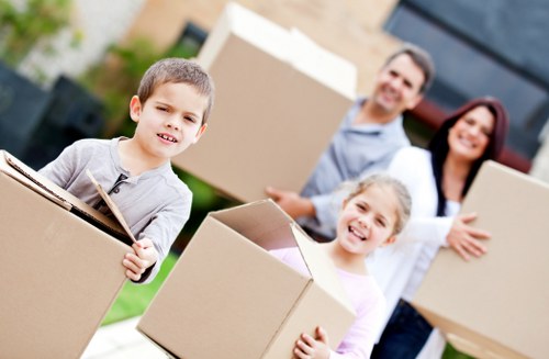 Packed boxes and furniture being loaded for transport