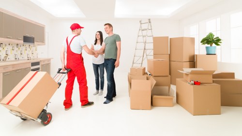 Packed boxes and furniture prepared for a local move in Brixton