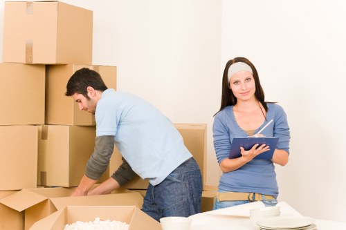 Professional commercial movers handling office equipment in Brixton